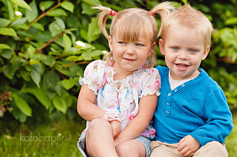Brother and sister hugging each other 