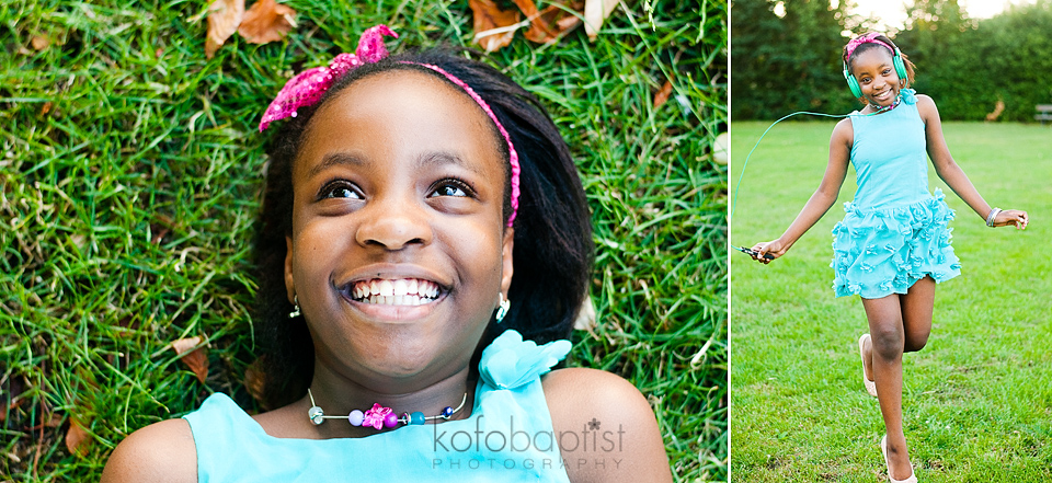Young girl lying down on green grass