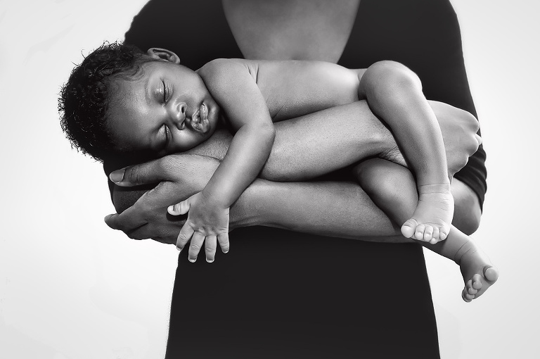 Mother holding newborn baby in her arms