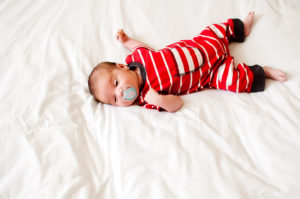 Baby sleeping in cot.