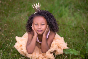 Beautiful girl wearing princess crown by London child photographer Kofo Baptist.