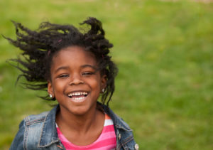Wind blowing into a young child's hair by London child photographer Kofo Baptist.