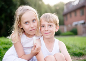 Photo of brother and sister captured outdoors by child photographer Kofo Baptist