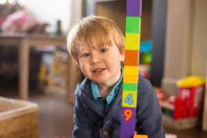 Toddler playing with Lego