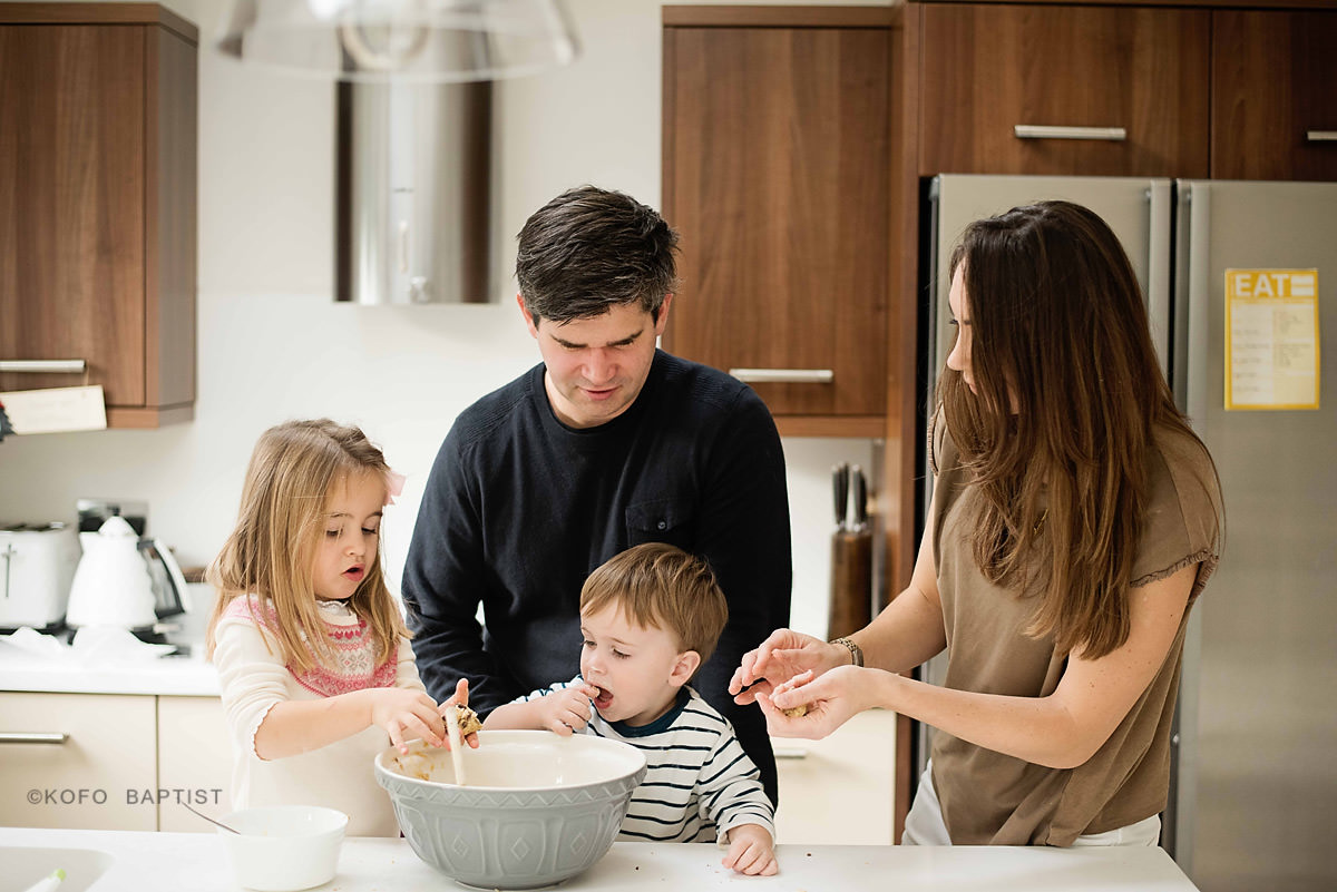 Family baking cookies together