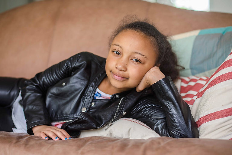 Young girl lying on sofa