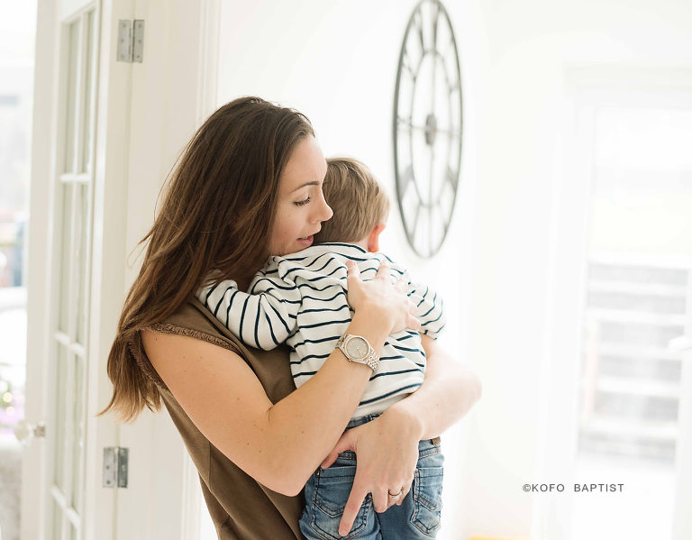 Mummy cuddling toddler son