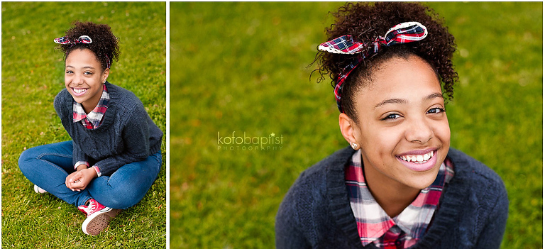 Teen girl sitting on grass in the park.