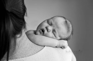 Newborn on mummy's shoulders.