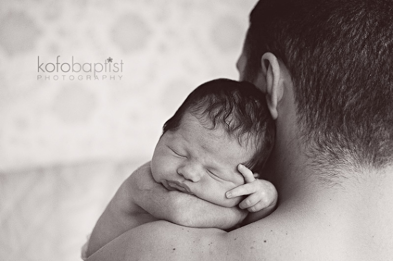 Newborn on daddy's shoulder 
