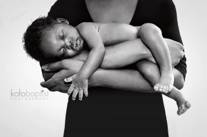 Newborn baby in mother's arms