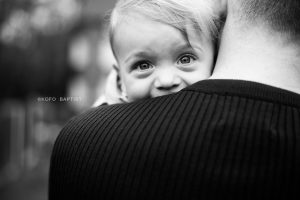 Portrait of toddler boy on daddy's shoulder